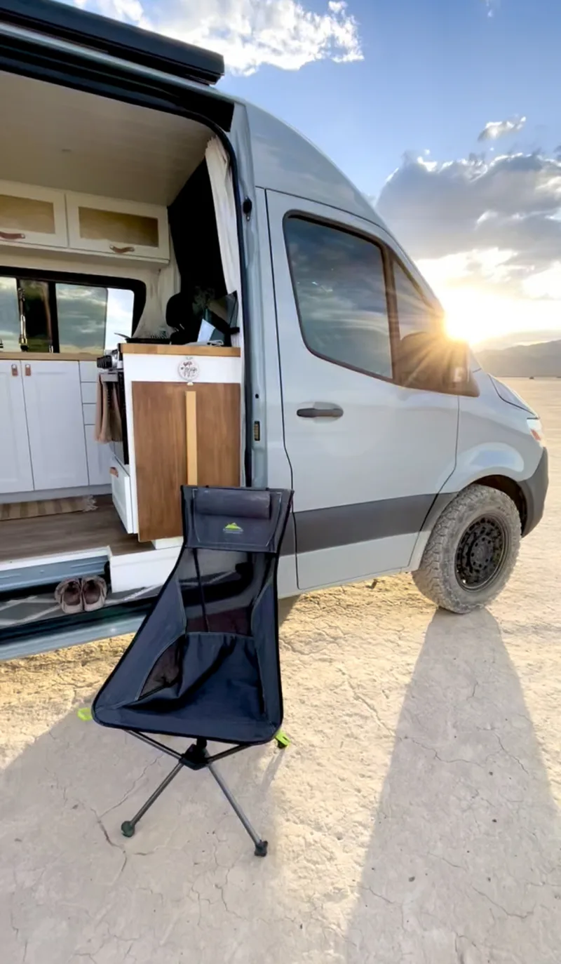 Camp chair beside Pebbles’ open sliding door