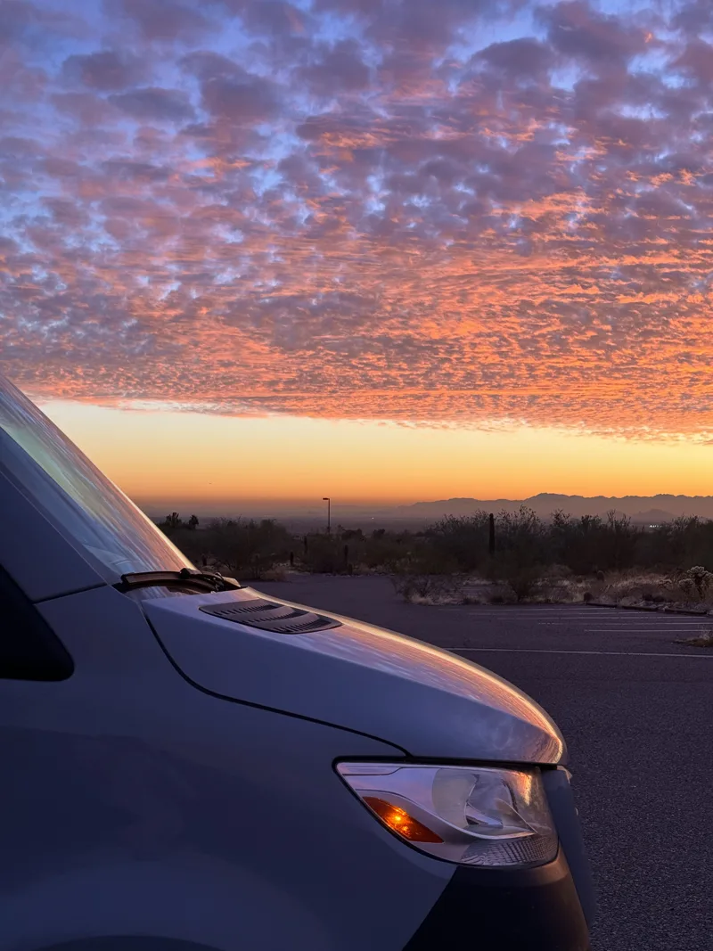 Pink and purple sunset above Pebbles’ windshield