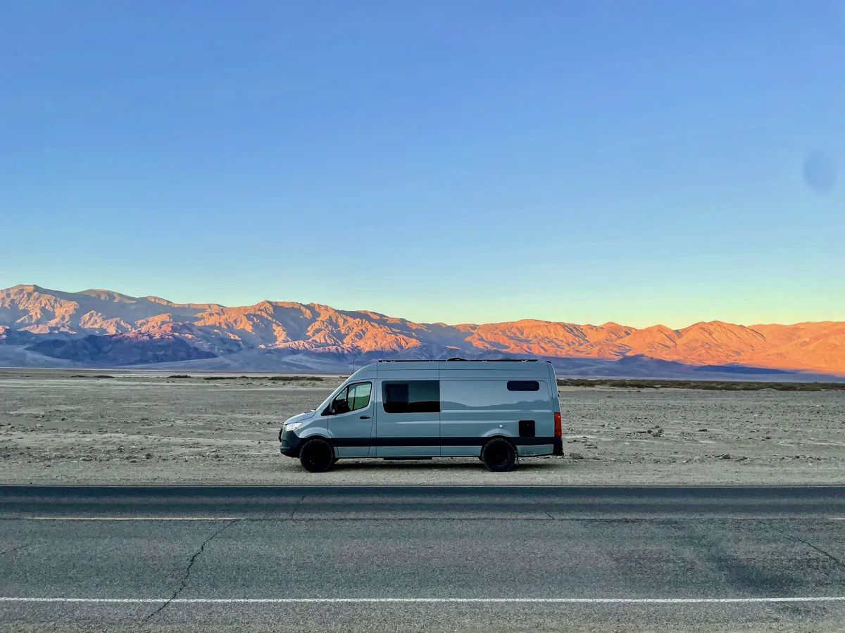 Pebbles on the road in Death Valley at sunset