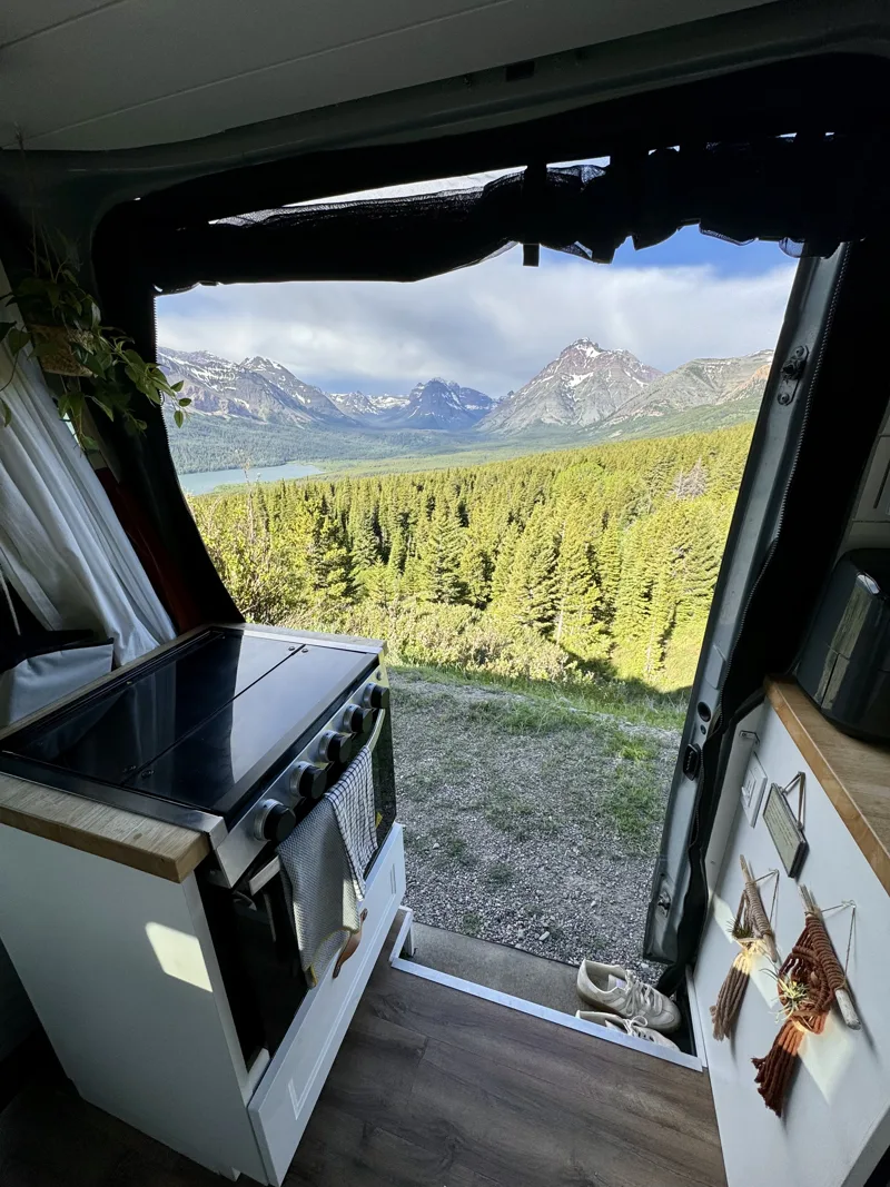 Mountain and forest scenery through the kitchen doorway
