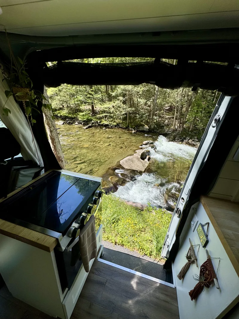 Rocky rapids beside the open kitchen door