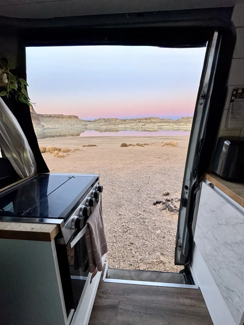 Pastel sunset over the desert through the kitchen doorway