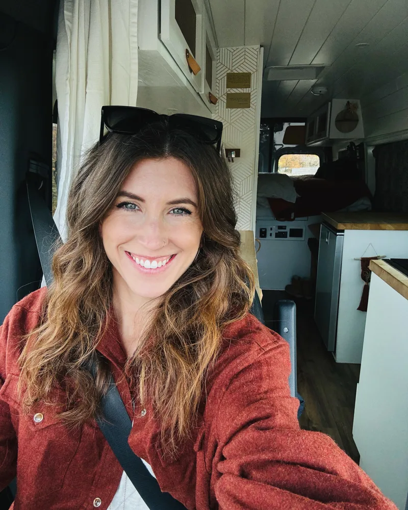 Steph smiling inside the van