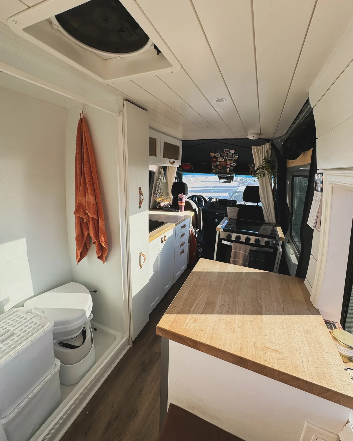 View along Pebbles’ interior with the bathroom and dining table