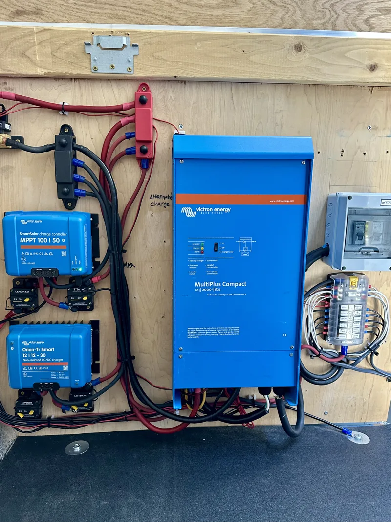 Victron inverter and electrical wiring mounted beneath the bed