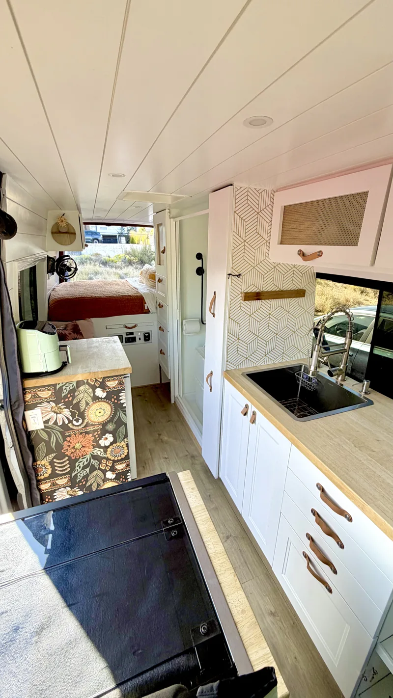 Interior view showing the wallpaper and kitchen cabinetry