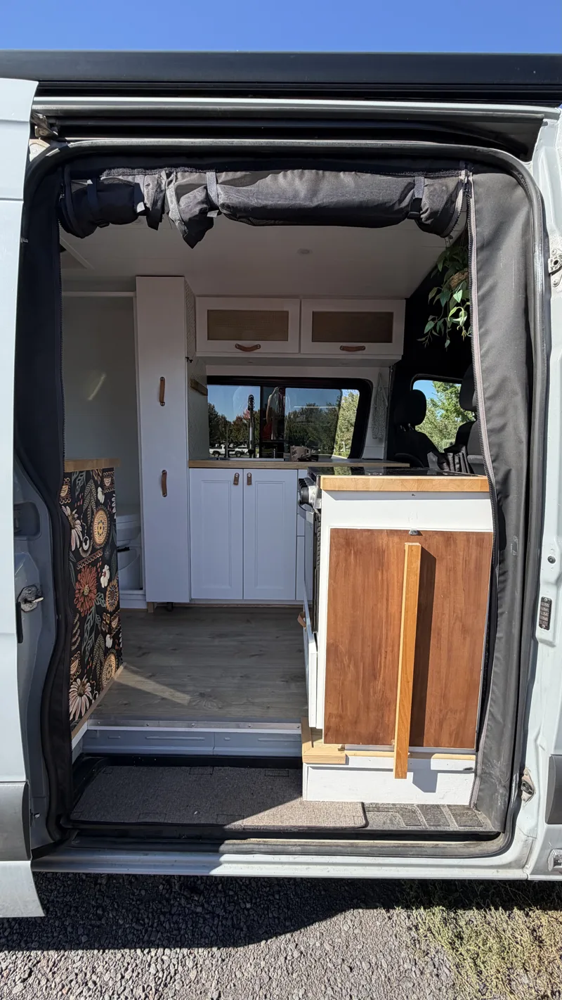 View into the living space through the screened sliding doorway