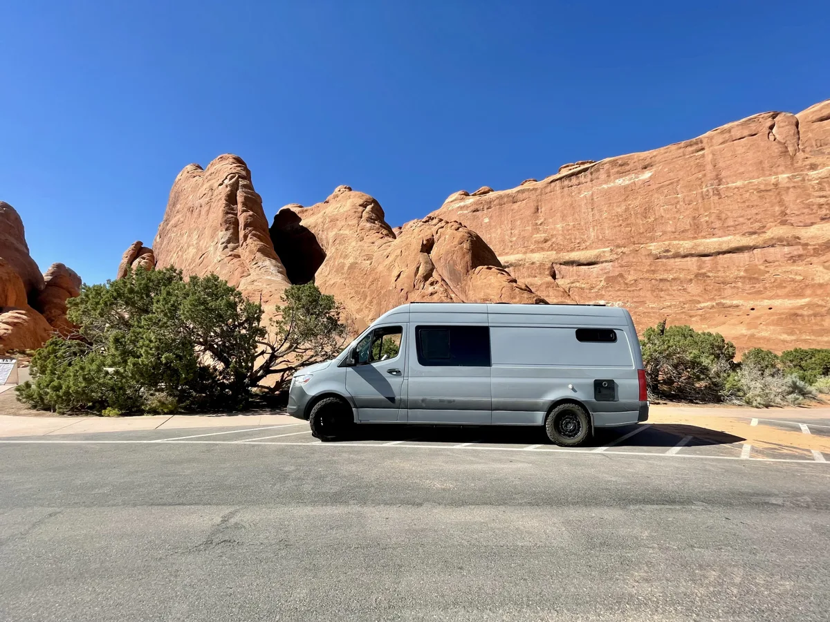 Side profile of Pebbles against red rock cliffs