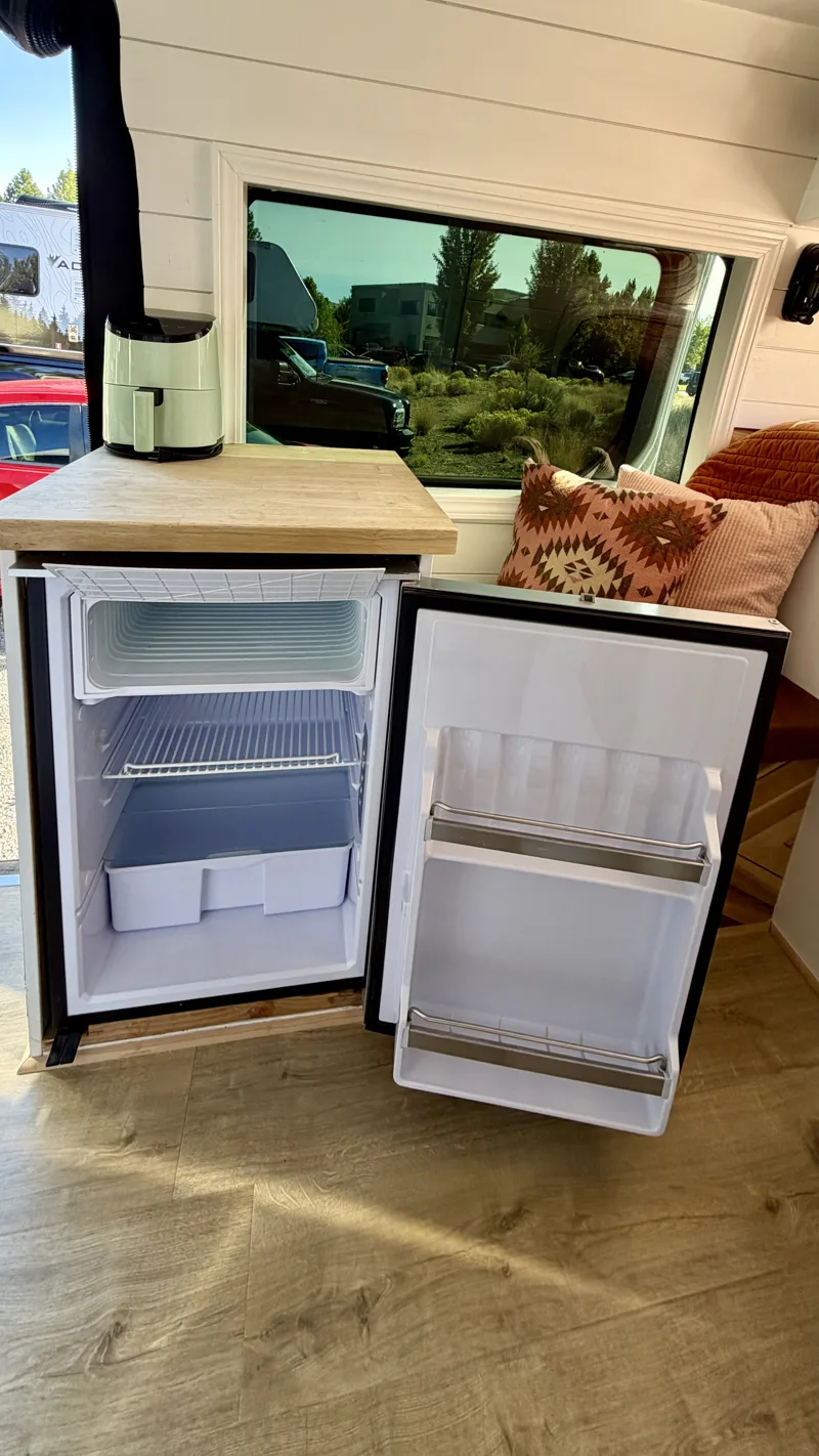 Open Isotherm refrigerator showing the freezer and shelves