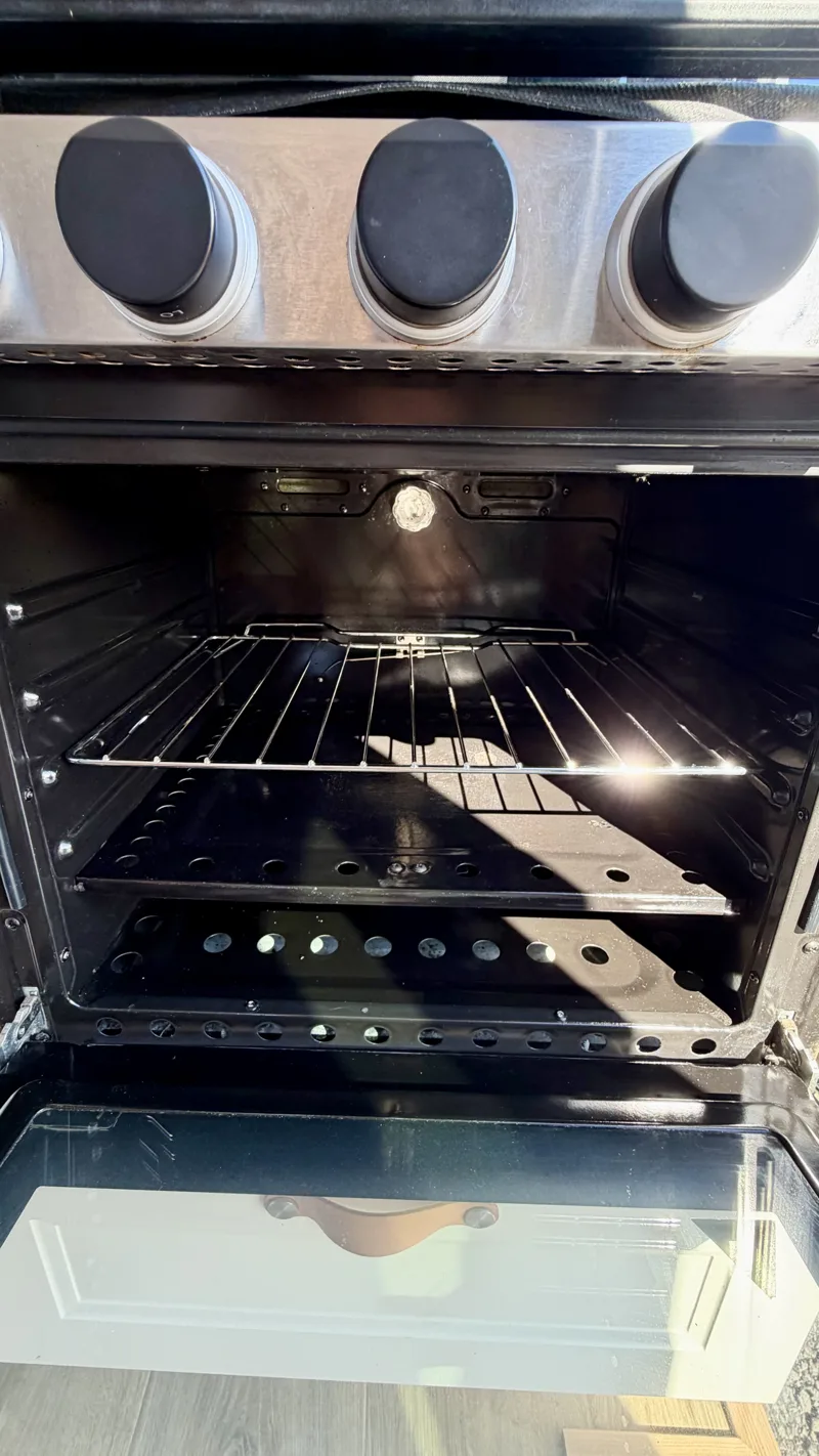 Inside the oven with baking racks and cookware