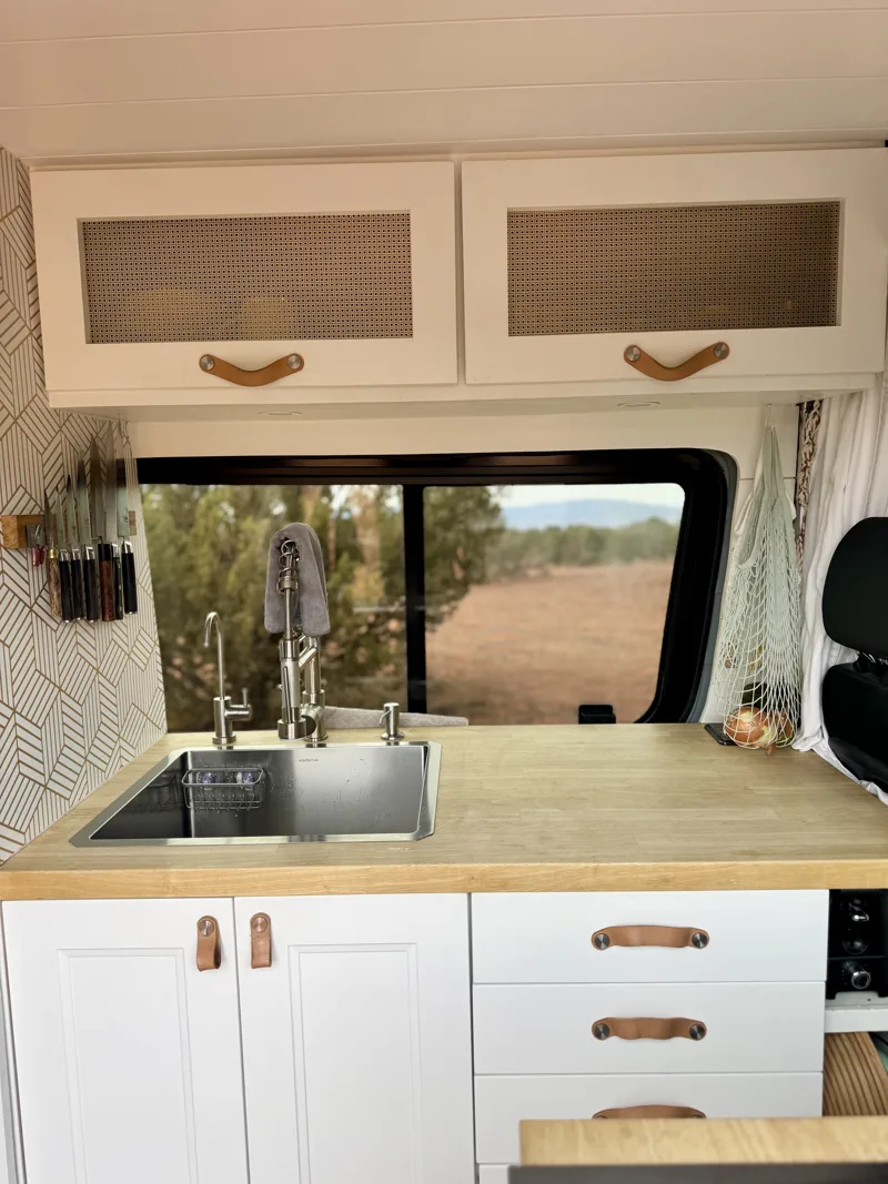 Kitchen sink and cabinetry viewed straight on