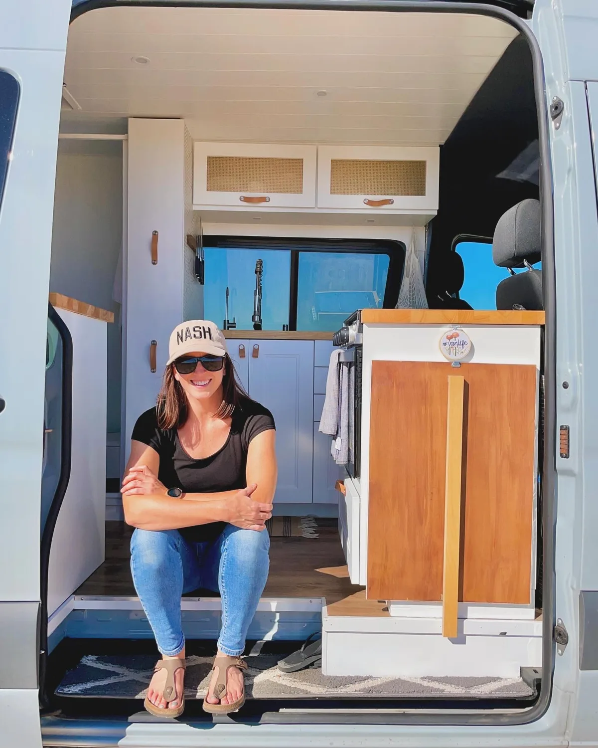 Stephanie seated in Pebbles’ open sliding doorway
