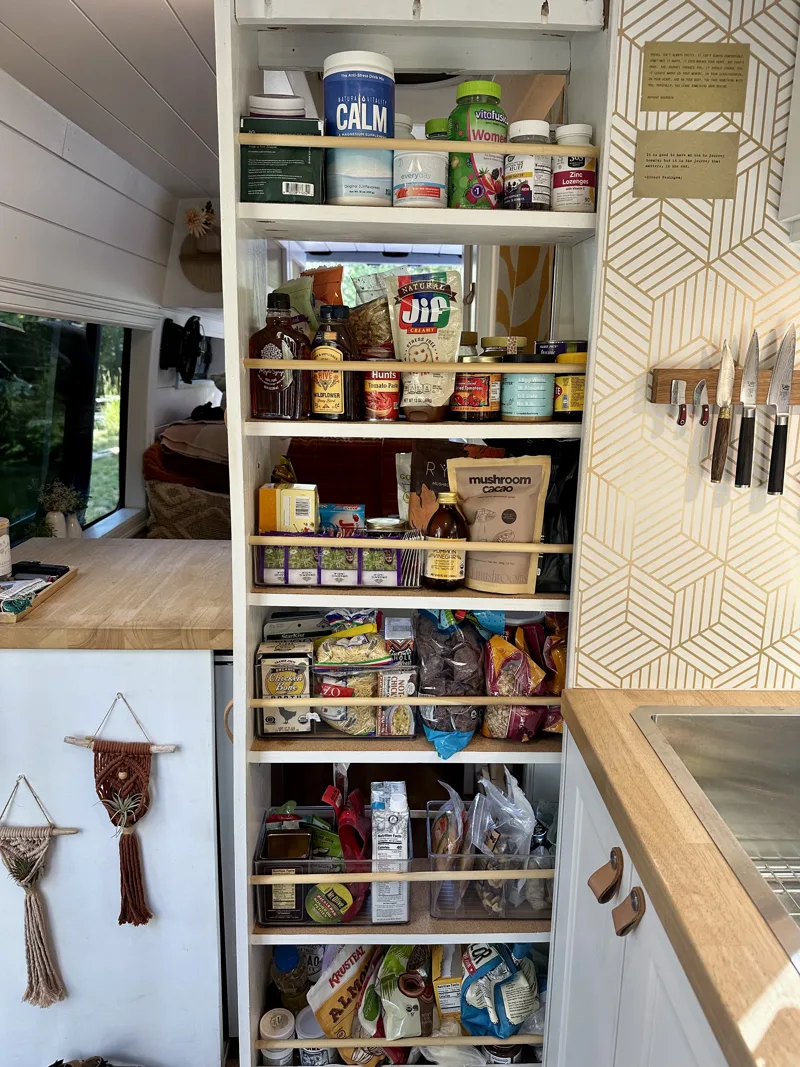 Open pantry stocked with food and kitchen essentials