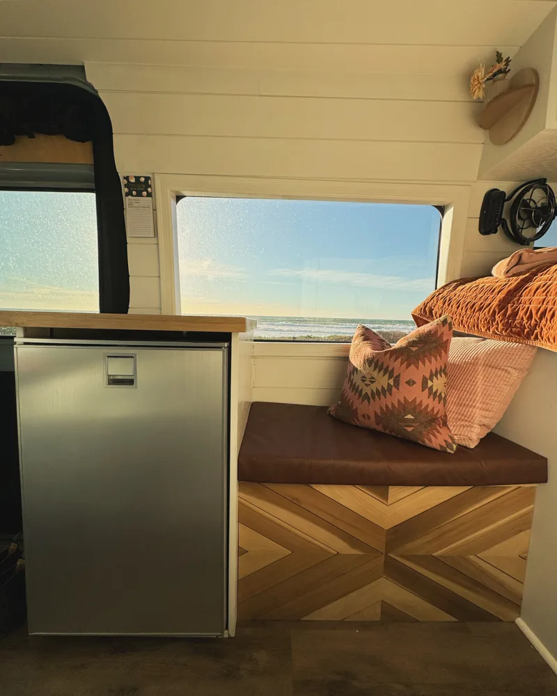 Bench seating beside the fridge and kitchen counter