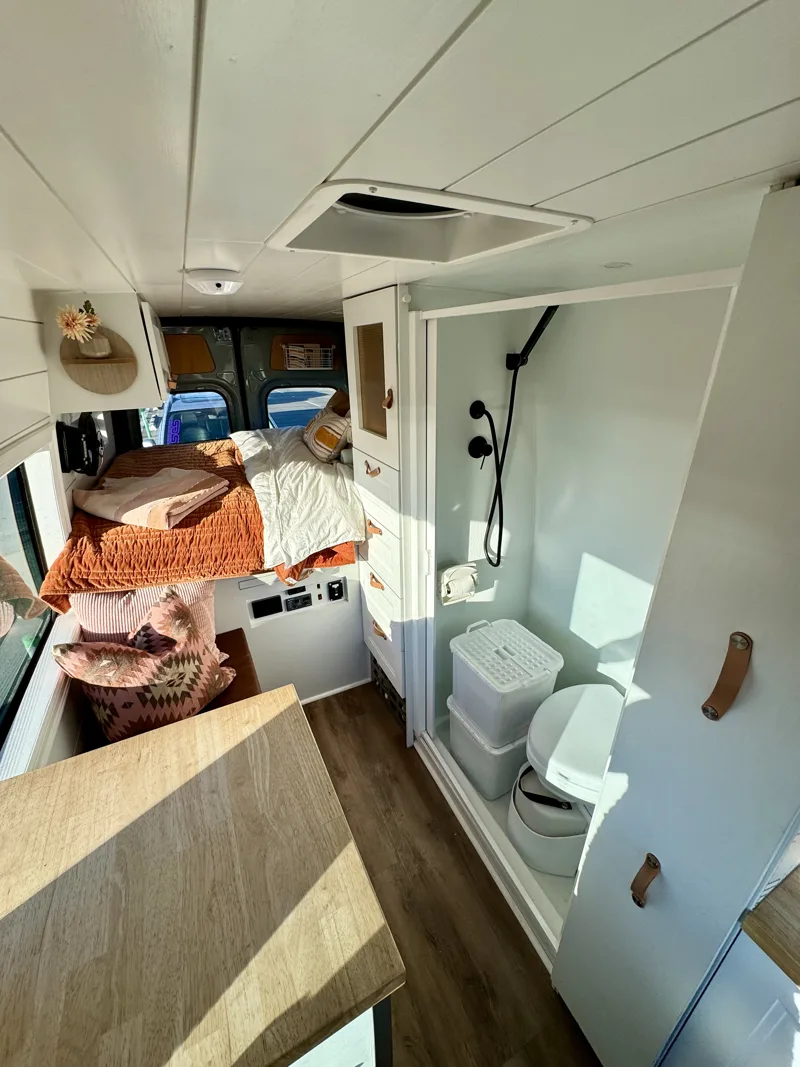 View toward the bed with kitchen and bathroom alongside